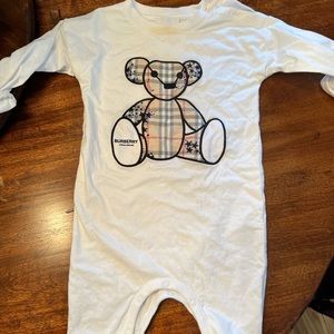 Closed toe baby Burberry romper.